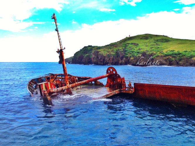 Even a wrecked ship by the port of Basco looks stunning